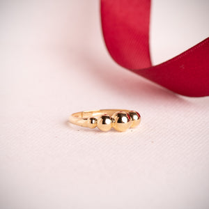 Anillo cinco bolas en disminución oro 18k