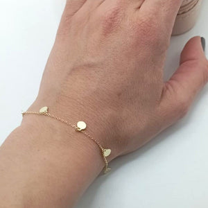 Pulsera de plata fina con colgantes en forma de chapita redonda foto