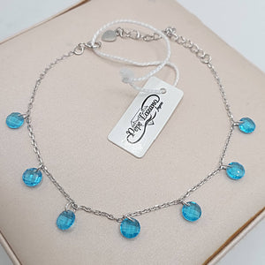 Pulsera de plata fina con circonitas redondas azules colgando hd