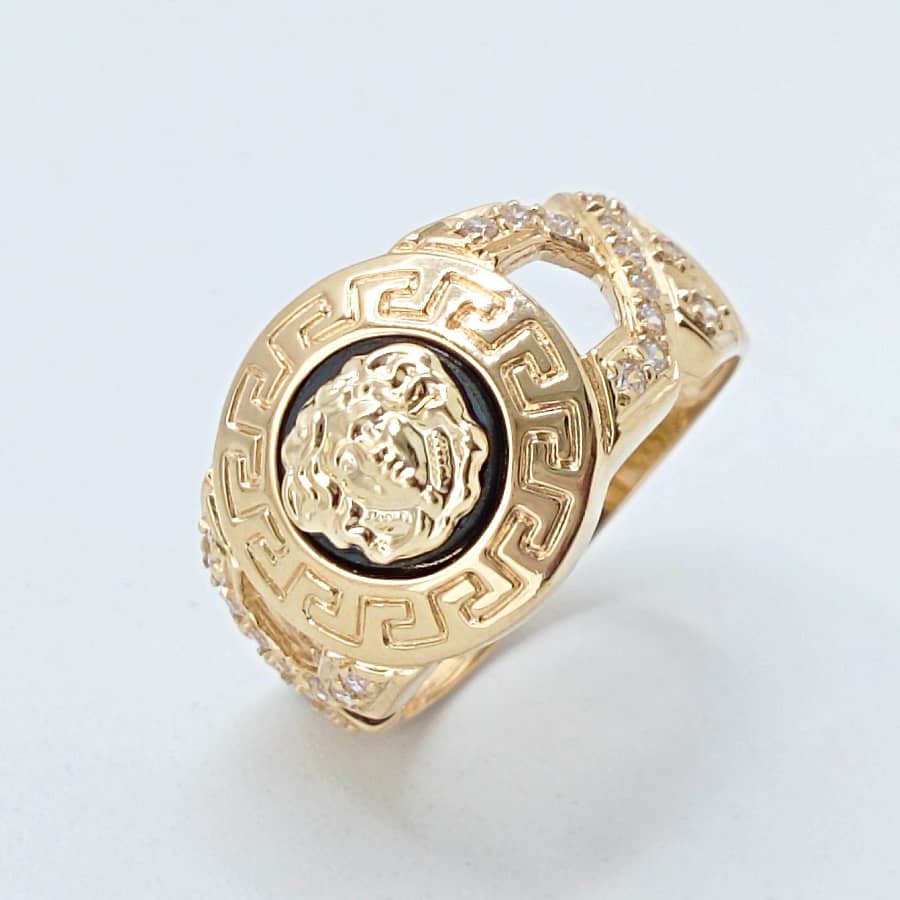 Anillo de oro 18k con medusa y circonitas fondo ónix negro foto