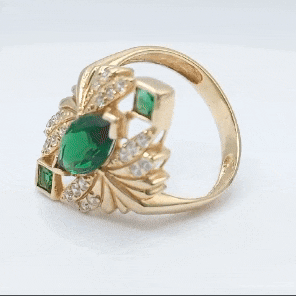 Anillo de oro 18k tipo lanzadera grande piedra verde gif
