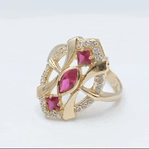 Anillo de oro 18k tipo lanzadera tres piedras fucsia gif