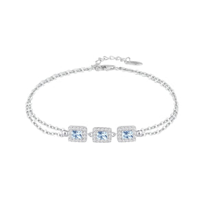 Pulsera de plata de ley 925 con tres circonitas color aguamarina y orla de blancas
