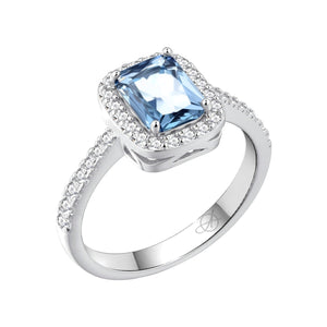 Anillo de plata de ley 925 con circonita rectangular color aguamarina orlada