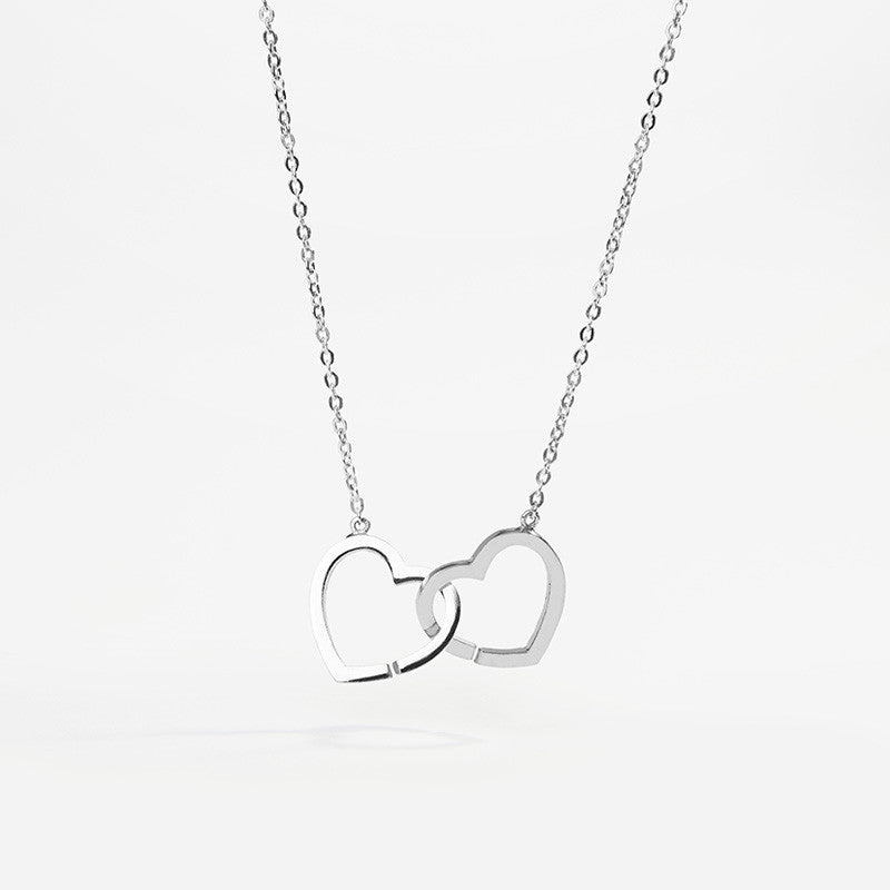 Cadena de plata de ley 925 rodiada con dos corazones entrelazados