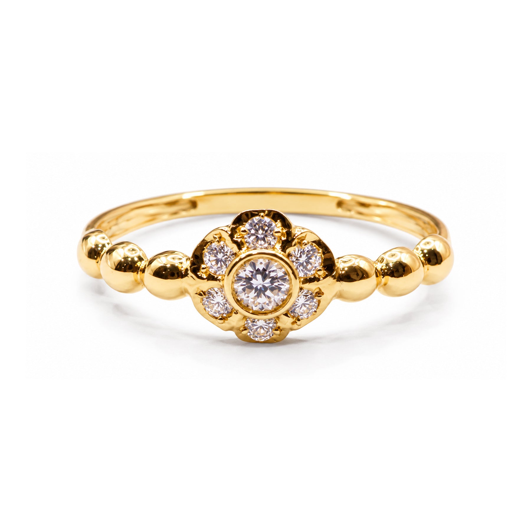 Sortija de oro 18k con flor de circonitas y brazo decorado con bolas