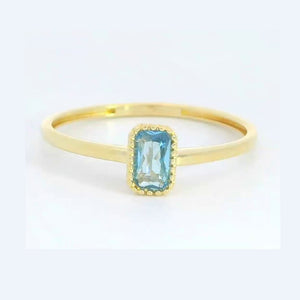 Anillo oro 9k circonita color aguamarina