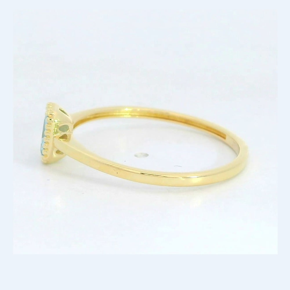 Anillo oro 9k circonita color aguamarina