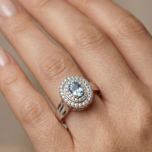 Anillo de plata de ley 925 con circonita aguamarina y doble orla de circonitas