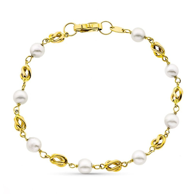 Pulsera de oro para niña de comunión con perlas y jaulas intercaladas.