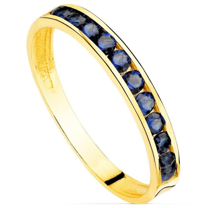 Anillo de oro 18k con circonitas azules en carril